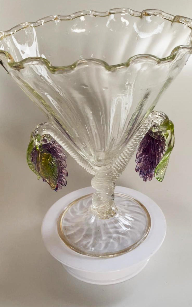 Clear vase with grape vines